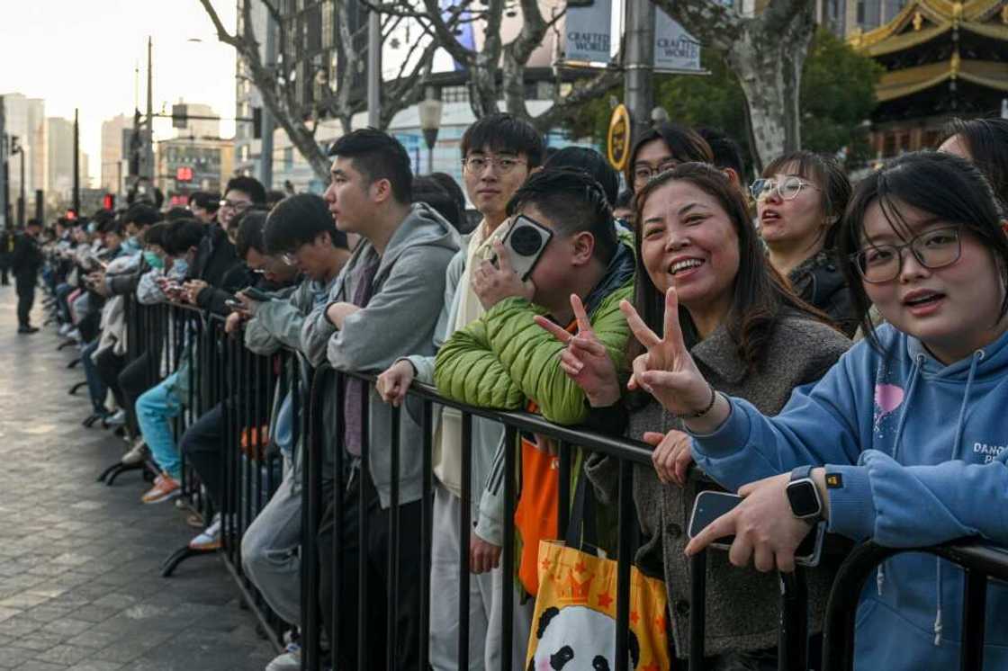 Customers lined up sometimes for days outside of Shanghai's new Apple retail store before its grand opening Customers lined up sometimes for days outside of Shanghai's new Apple retail store before its grand opening