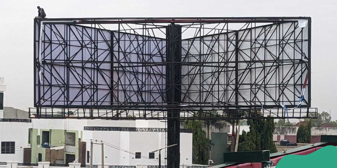 Man climbs billboard, threatens to kill himself in Kano state Man climbs billboard, threatens to kill himself in Kano state