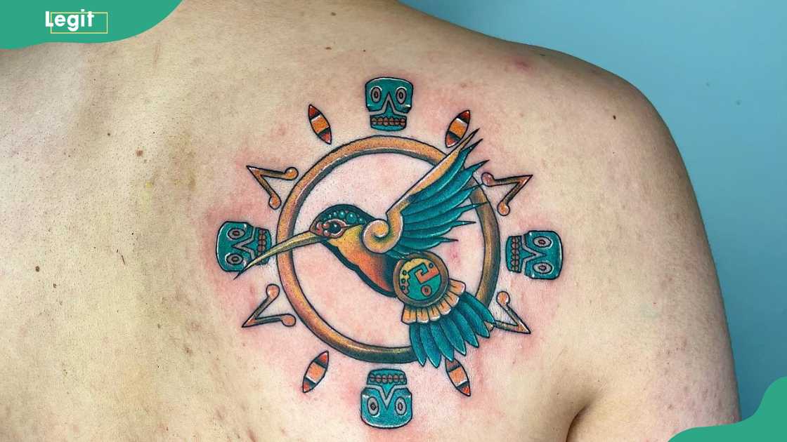 Aztec-style hummingbird tattoo