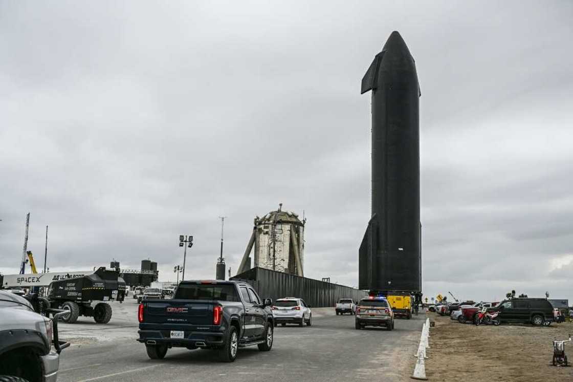 People gather as SpaceX Starship spacecraft prototype is transported from the launch site ahead of the SpaceX Starship third flight test from Starbase in Boca Chica, Texas People gather as SpaceX Starship spacecraft prototype is transported from the launch site ahead of the SpaceX Starship third flight test from Starbase in Boca Chica, Texas