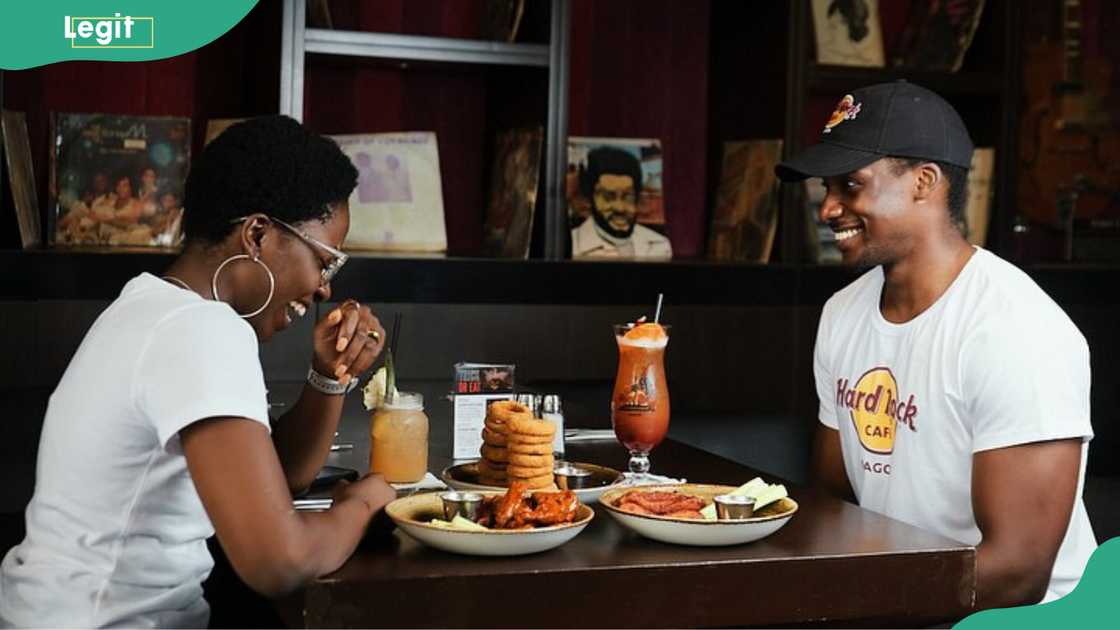 People having a meal at Hard Rock Cafe Lagos People having a meal at Hard Rock Cafe Lagos