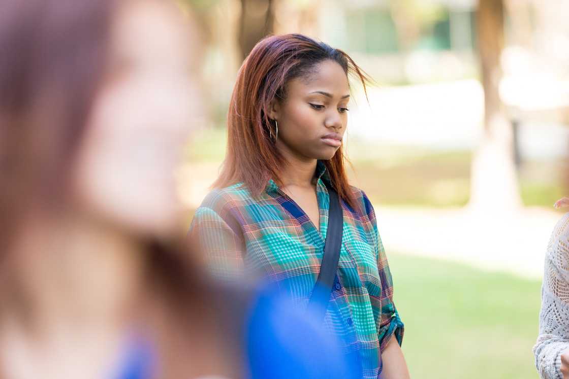 Sad girl walking outdoors