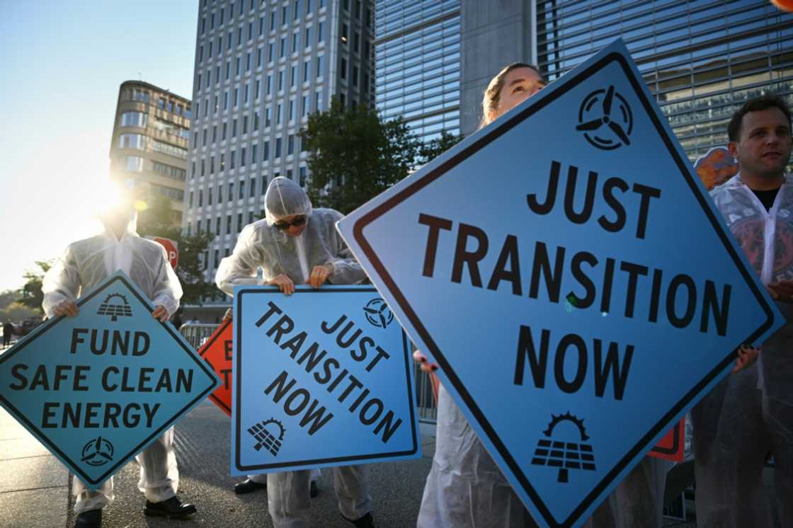 Activists protest against investment in fossil fuels outside of the World Bank headquarters in Washington, DC