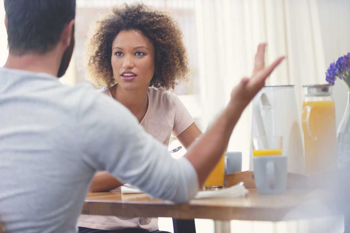 A couple fighting at the breakfast table A couple fighting at the breakfast table