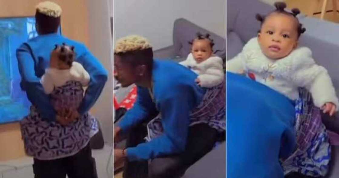 Father backs baby at home Father backs baby at home