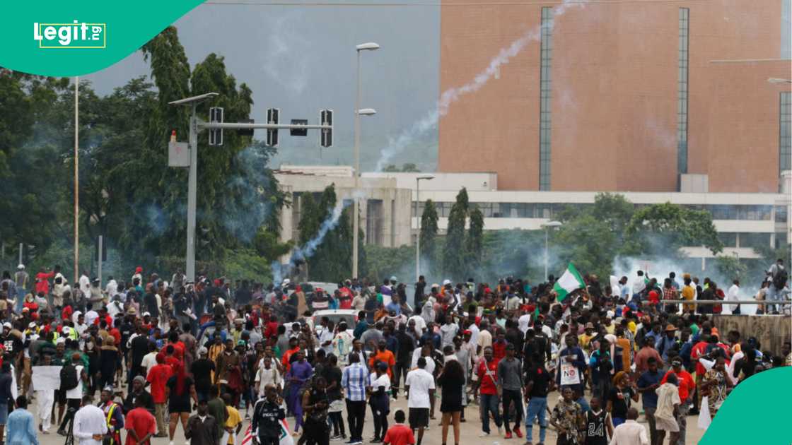 Demonstrators challenge Tinubu government over alleged interference in democracy.