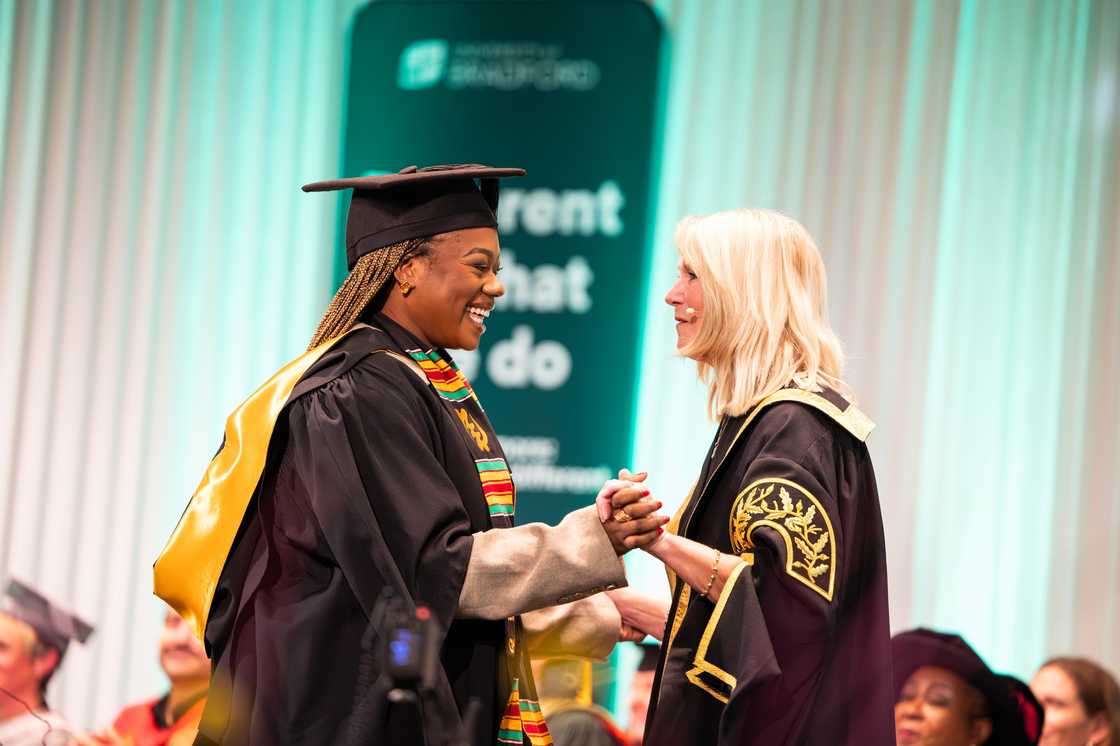 University of Bradford student being congratulated on her graduation