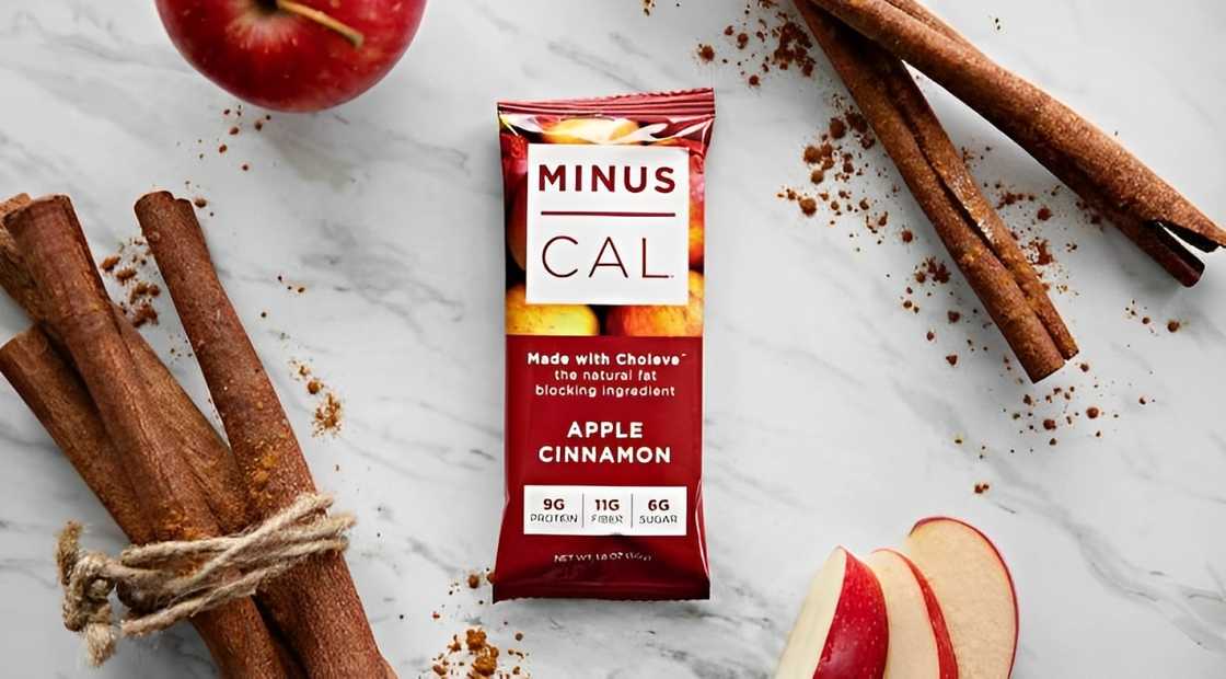 Minus Cal apple cinnamon bar with cinnamon sticks and apples on the side Minus Cal apple cinnamon bar with cinnamon sticks and apples on the side