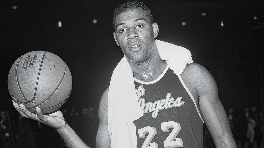 Elgin Baylor poses with a ball after scoring 71 points in a game against the New York Knicks. Elgin Baylor poses with a ball after scoring 71 points in a game against the New York Knicks.