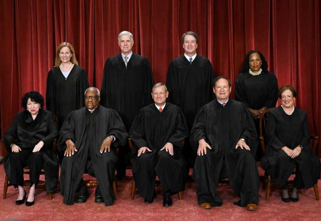 The nine justices of the US Supreme Court pose for their official photo The nine justices of the US Supreme Court pose for their official photo