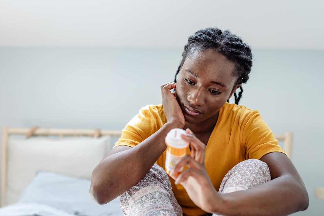 A lady holds her medicine