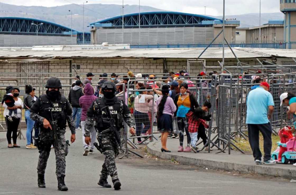 Members of Ecuador's Police Intervention and Rescue Group (GIR) outside the Regional Sierra Centro Norte Cotopaxi prison Members of Ecuador's Police Intervention and Rescue Group (GIR) outside the Regional Sierra Centro Norte Cotopaxi prison