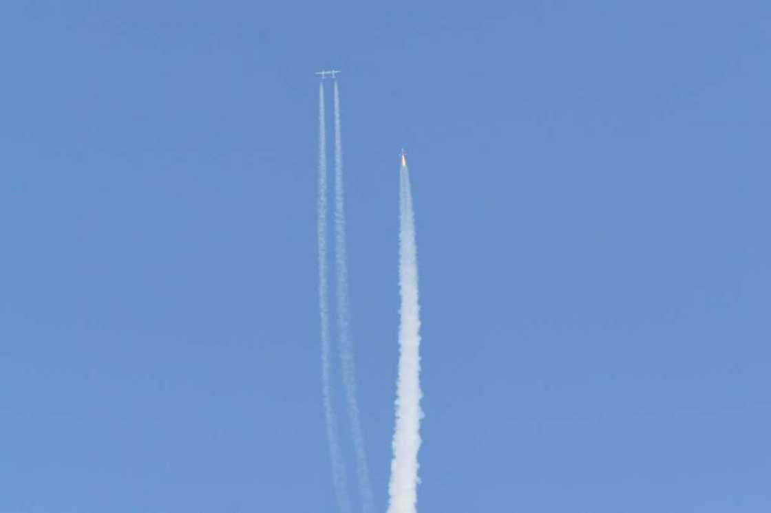 The Virgin Galactic SpaceShipTwo space plane Unity and mothership separate as they fly way above Spaceport America in New Mexico on July 11, 2021