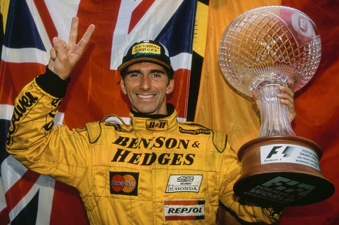 Damon Hill celebrates with the trophy after winning the Belgian Grand Prix in August 1998 Damon Hill celebrates with the trophy after winning the Belgian Grand Prix in August 1998