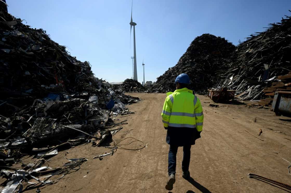 Ships are broken down into 50 recyclable materials at Belgium's Galloo, with a windmill generating its power Ships are broken down into 50 recyclable materials at Belgium's Galloo, with a windmill generating its power