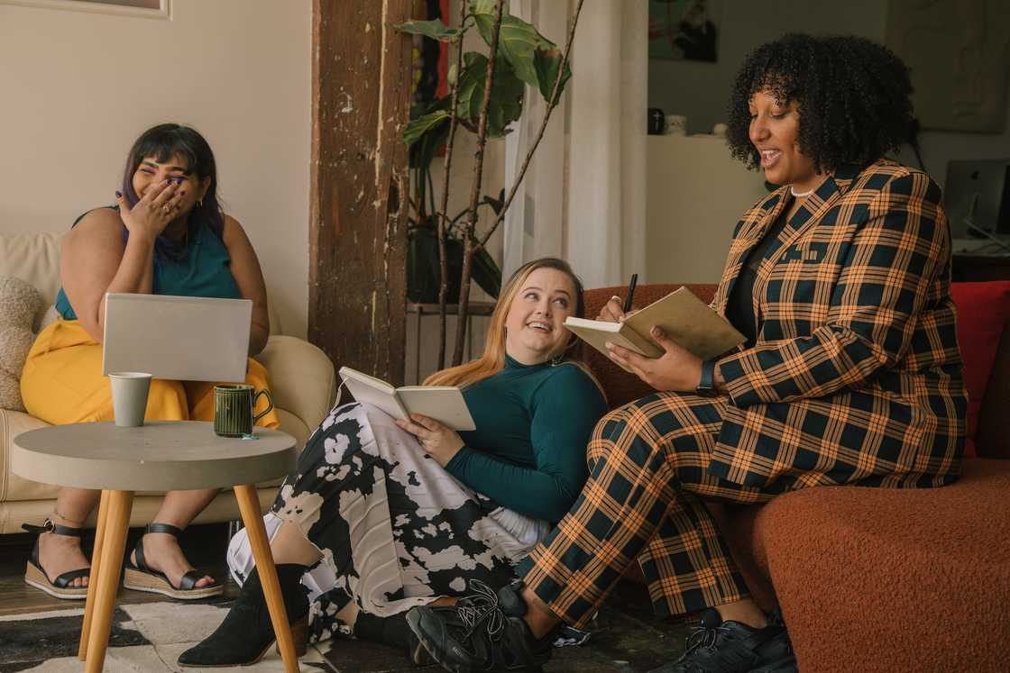 Female colleagues laughing together