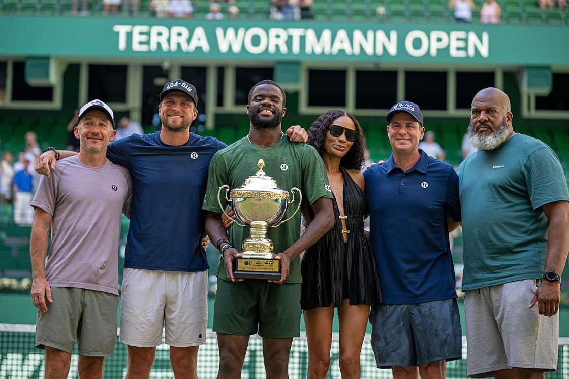Frances Tiafoe, his girlfriend and other team members celebrate