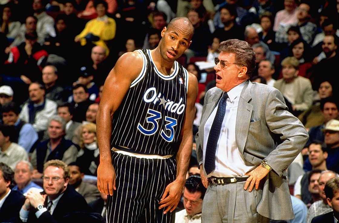 NBA Basketball: Orlando Magic's Derek Strong speaking to coach Chuck Daly during game vs Vancouver Grizzlies. Vancouver, Canada NBA Basketball: Orlando Magic's Derek Strong speaking to coach Chuck Daly during game vs Vancouver Grizzlies. Vancouver, Canada