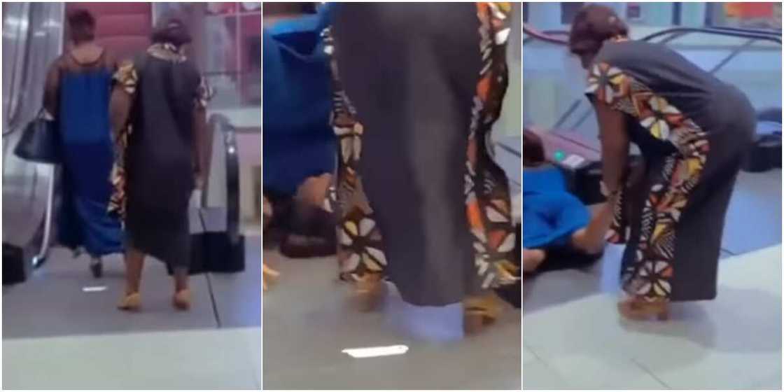 Woman falling from escalator Woman falling from escalator