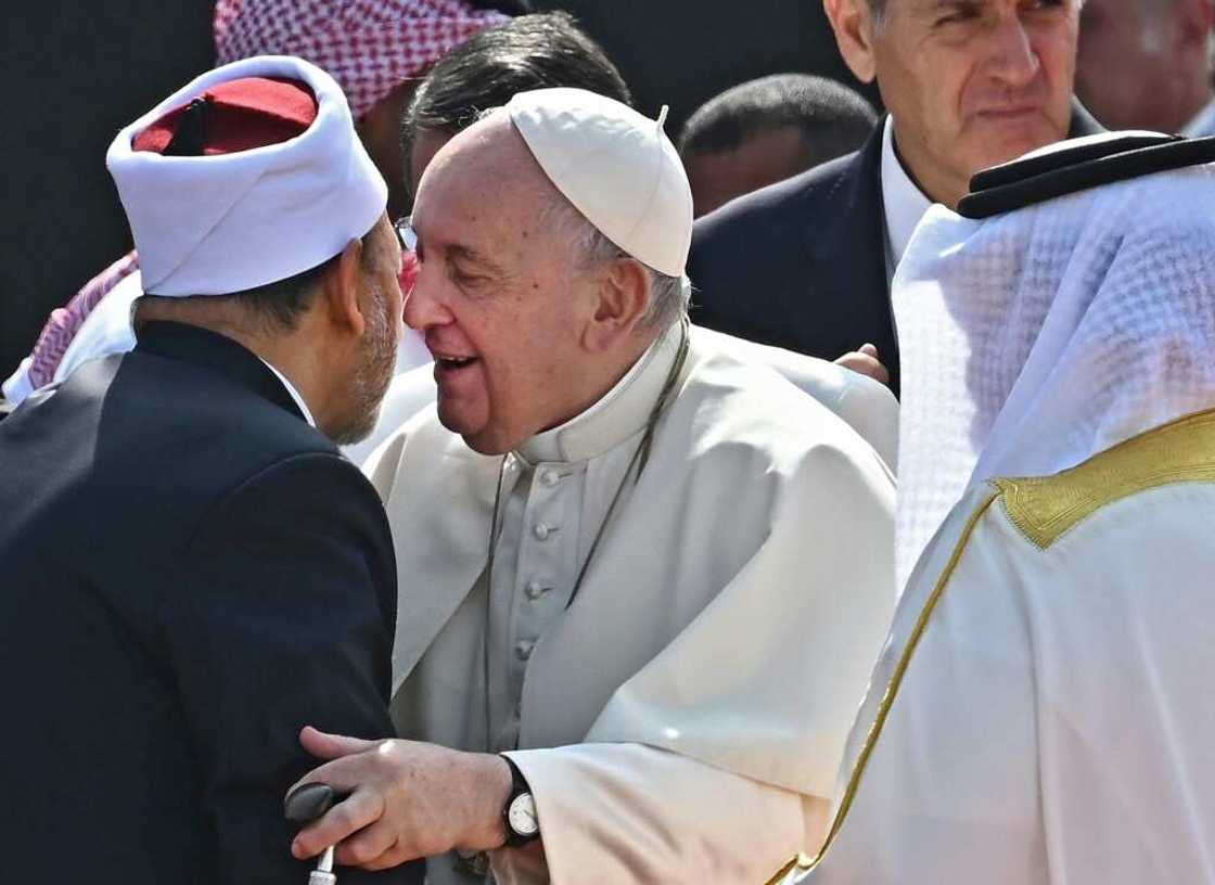 Pope Francis (C) embraced the grand imam of Al-Azhar mosque, Sheikh Ahmed Al-Tayeb Pope Francis (C) embraced the grand imam of Al-Azhar mosque, Sheikh Ahmed Al-Tayeb
