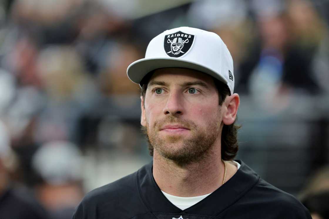 Retired NHL player James Neal looks on from the Las Vegas Raiders' sideline as the team warms up