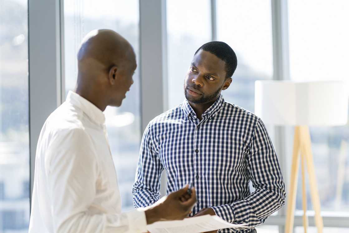 Businessmen discussing in office