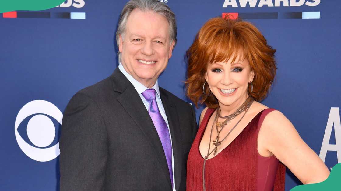 Antony Lasuzzo and Reba McEntire at an event