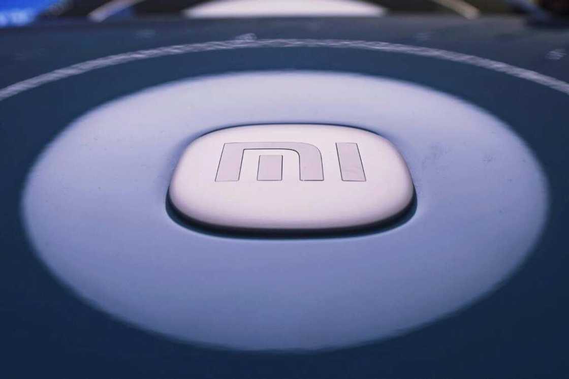 Xiaomi's logo featured on its new SU7 EV model at a shop in Hangzhou Xiaomi's logo featured on its new SU7 EV model at a shop in Hangzhou