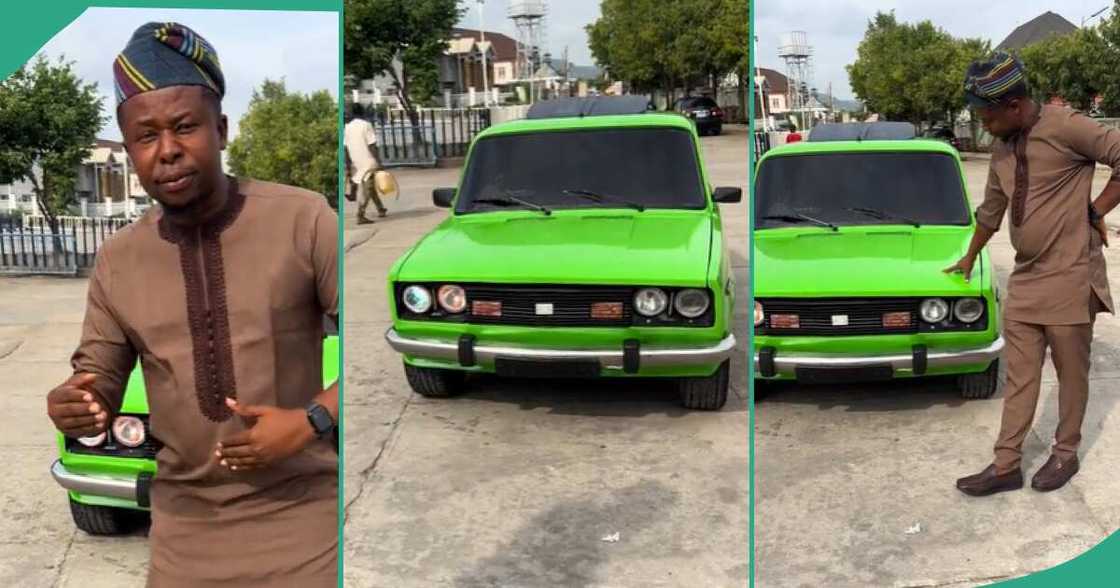 Man shows off an old car. Man shows off an old car.