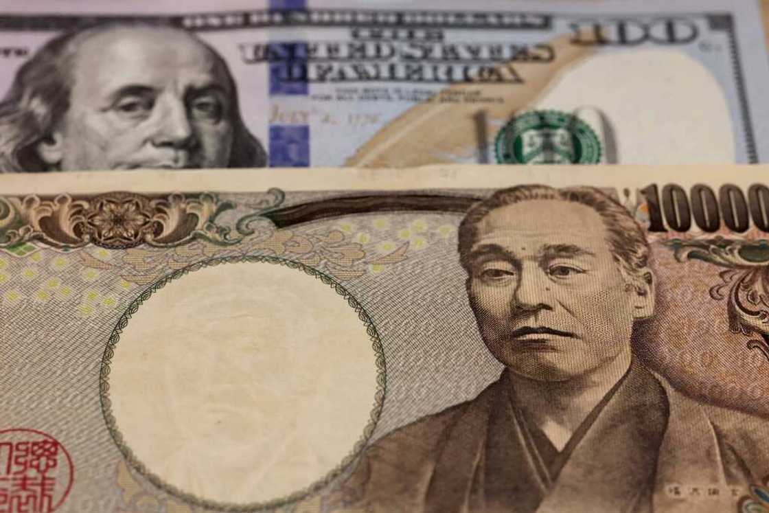 With the Bank of Japan holding off from hiking interest rates, the yen has fallen around 20 percent against the dollar this year With the Bank of Japan holding off from hiking interest rates, the yen has fallen around 20 percent against the dollar this year