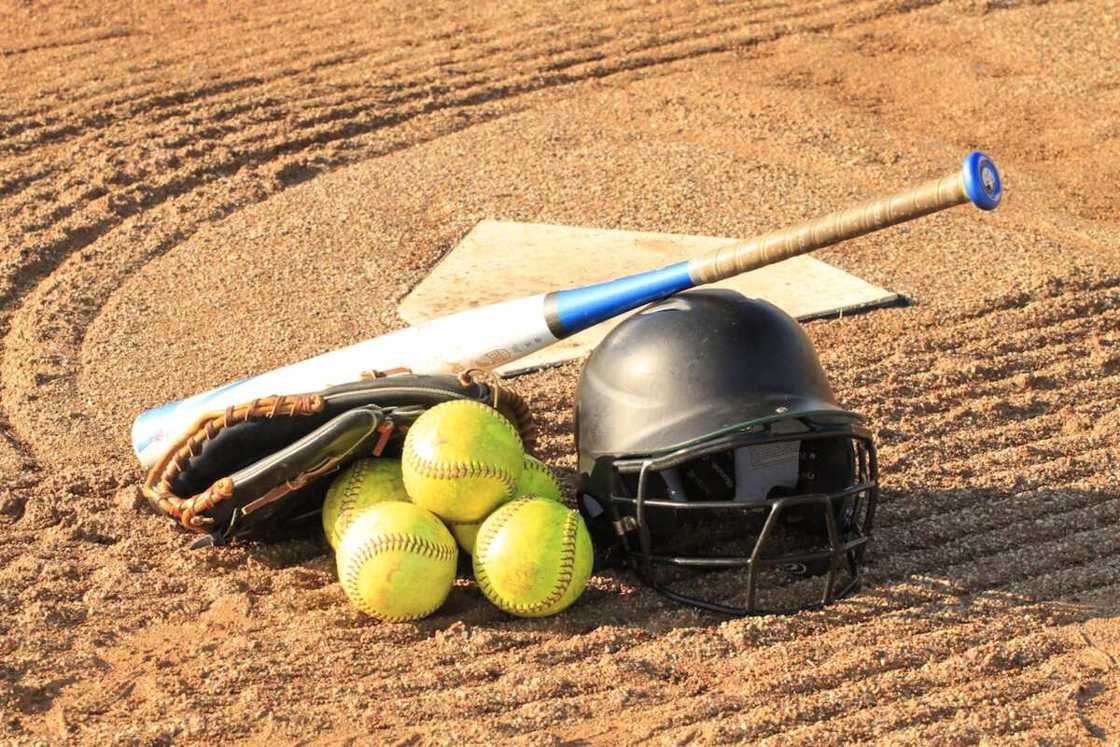 Softball game equipment on the ground