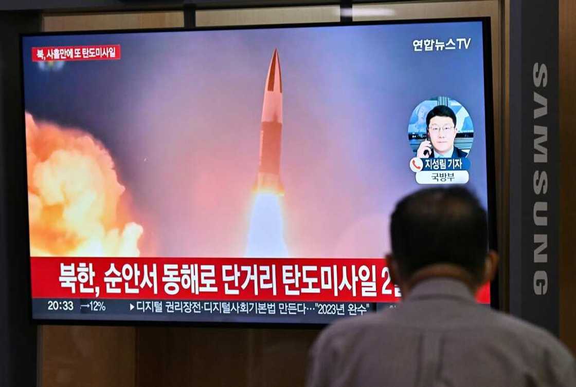 A man watches a news broadcast at a rail station in Seoul on Wednesday showing file footage of a North Korean missile test