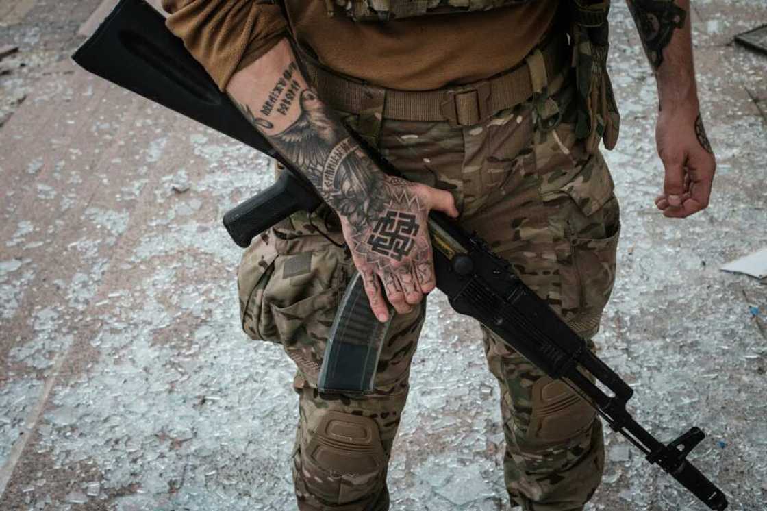 A Ukrainian soldier at the retaken station on Sunday A Ukrainian soldier at the retaken station on Sunday