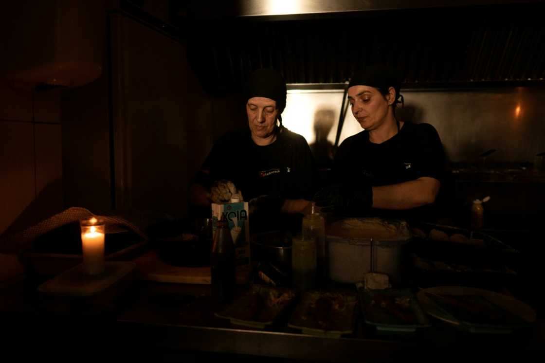 A restaurant operating without lights in Ronda, near the Spanish city of Malaga during a massive power cut that hit the Iberian Peninsula in April