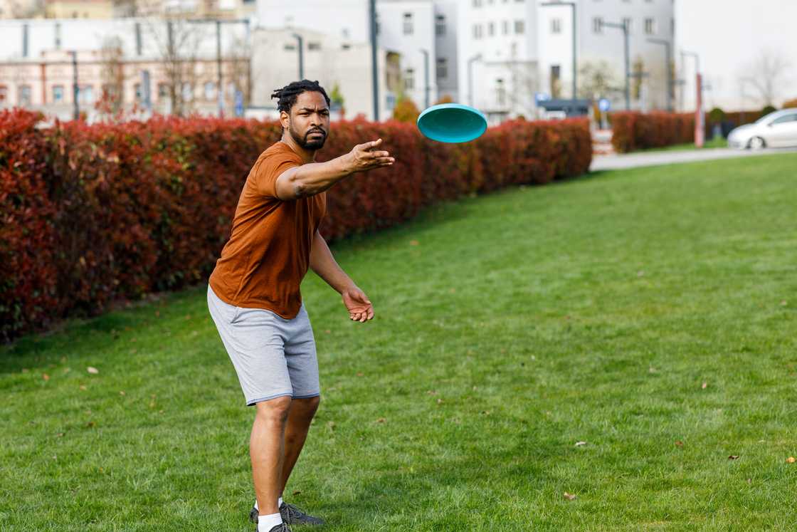 A man throwing a Frisbee in Public Park