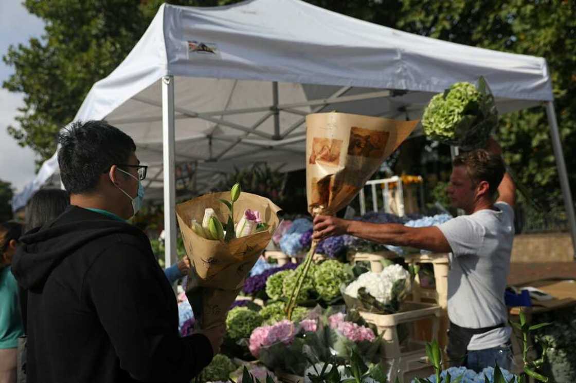 Flower sellers at the Columbia Road market in London told AFP they have been very busy Flower sellers at the Columbia Road market in London told AFP they have been very busy