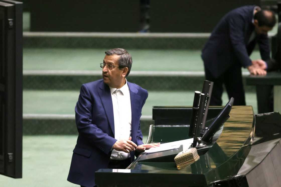 Iranian Finance Minister Abdolnaser Hemmati delivers a speech in parliament during impeachment proceedings against him