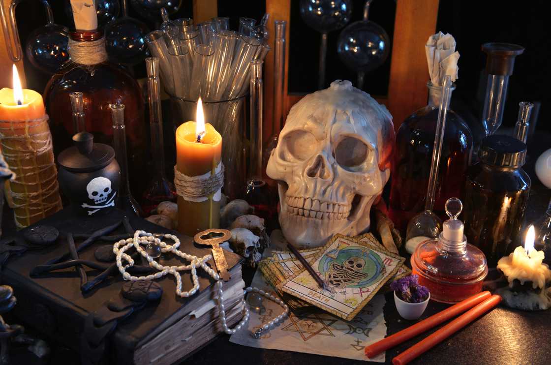 Magic still life with tarot cards, skull and burning candles Magic still life with tarot cards, skull and burning candles