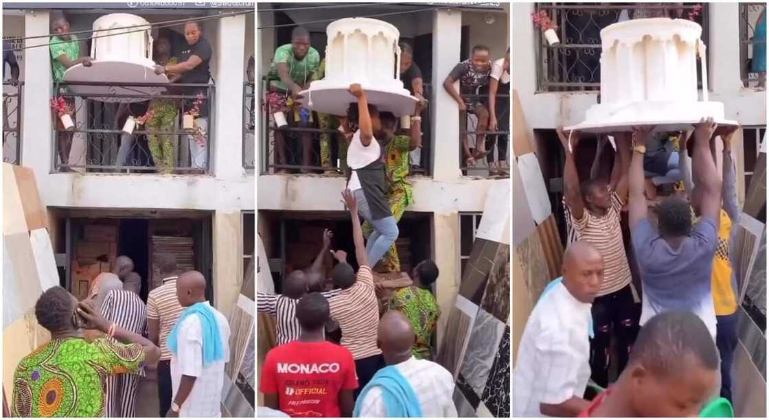 Photos of a giant cake being brought down from upstairs. Photos of a giant cake being brought down from upstairs.