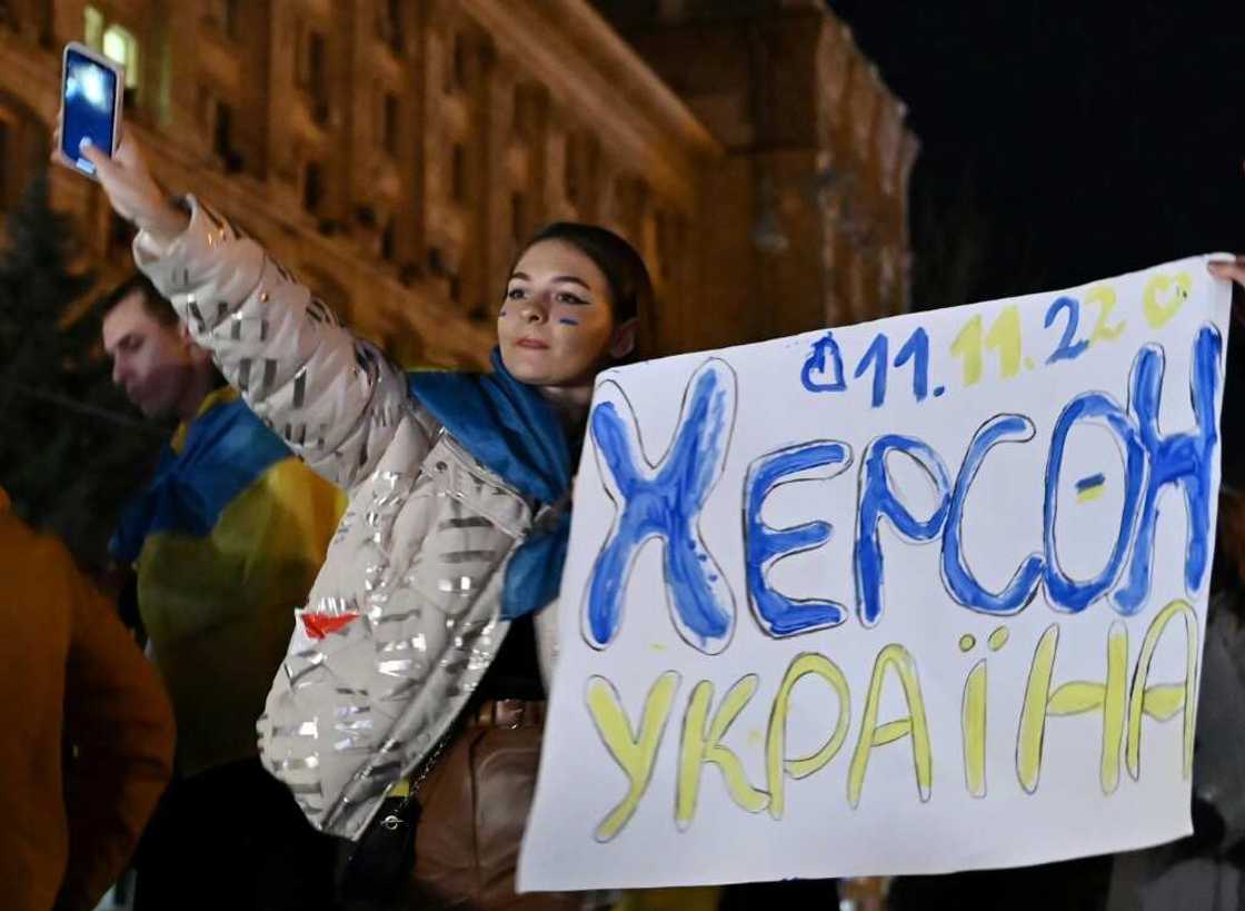 Kherson inhabitants who left for Kyiv when Russian soldiers captured their city in March began converging on Maidan Square at 7:00 pm