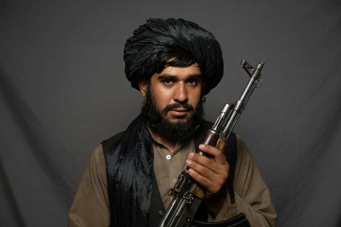 'I'm happy that the infidels are out,' said fighter Sharifullah Khobib 'I'm happy that the infidels are out,' said fighter Sharifullah Khobib