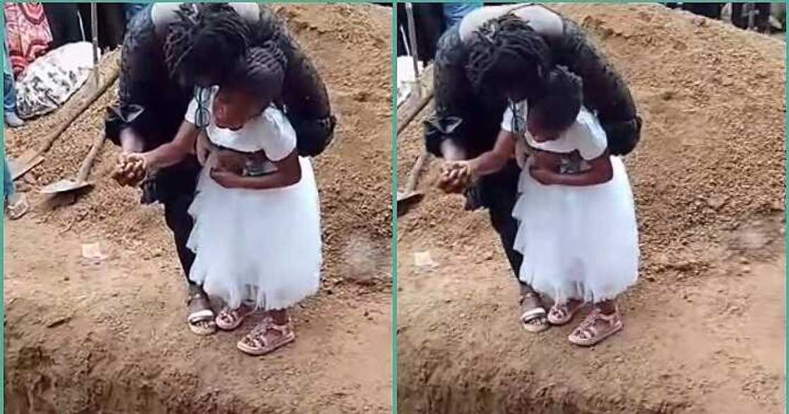 Little girl cries bitterly at her mother's graveside Little girl cries bitterly at her mother's graveside
