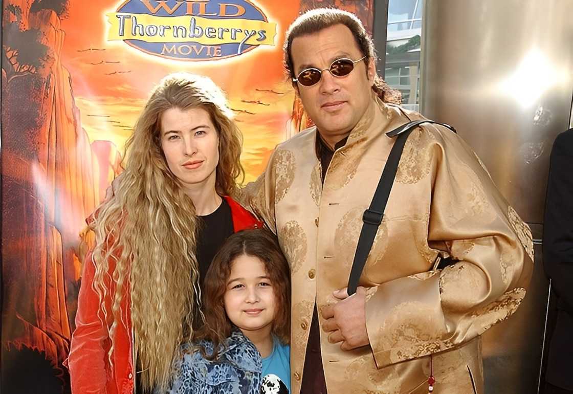 Steven Seagal, Arissa Wolf & daughter Savannah posing at the Cinerama Dome Steven Seagal, Arissa Wolf & daughter Savannah posing at the Cinerama Dome