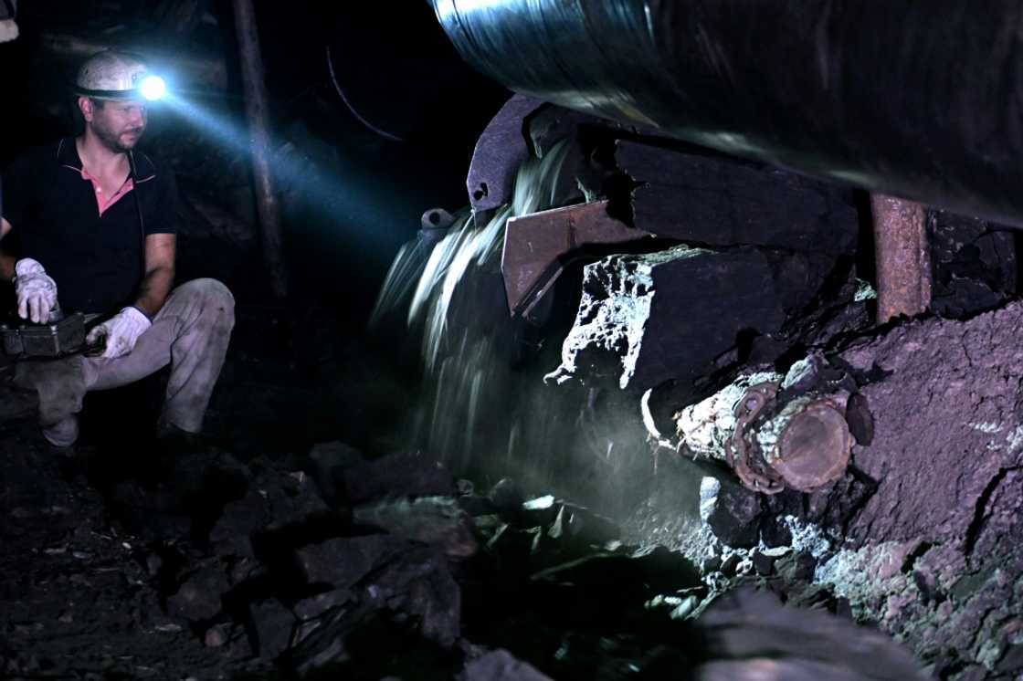 A miner works a 250-metre-deep shaft in the Mramor coal mine near Tuzla A miner works a 250-metre-deep shaft in the Mramor coal mine near Tuzla