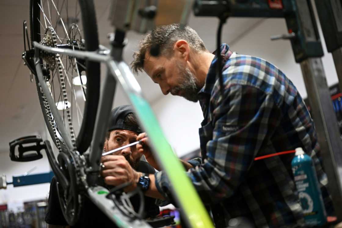 Mechanic trainer and workshop manager Nigel Brook teaches ex-prisoner Gary Oakley how to work on a bike Mechanic trainer and workshop manager Nigel Brook teaches ex-prisoner Gary Oakley how to work on a bike