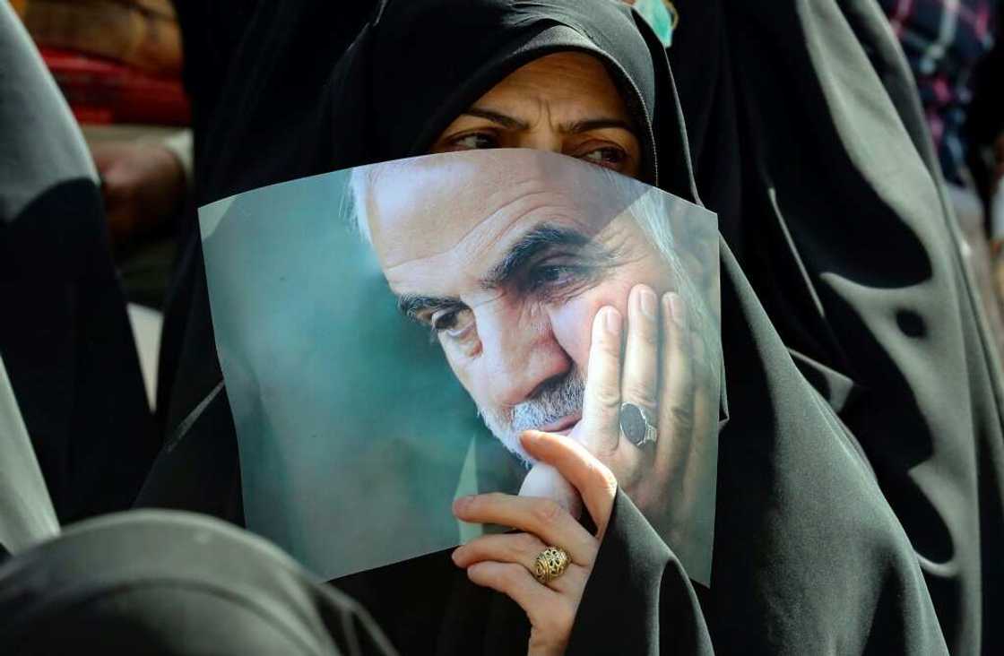 An Iranian carries a portrait of tje slain head of Iran's Islamic Revolutionary Guard Corps' "Quds Force", Qasem Soleimani, during a gathering in Tehran on May 26, 2022 An Iranian carries a portrait of tje slain head of Iran's Islamic Revolutionary Guard Corps' "Quds Force", Qasem Soleimani, during a gathering in Tehran on May 26, 2022