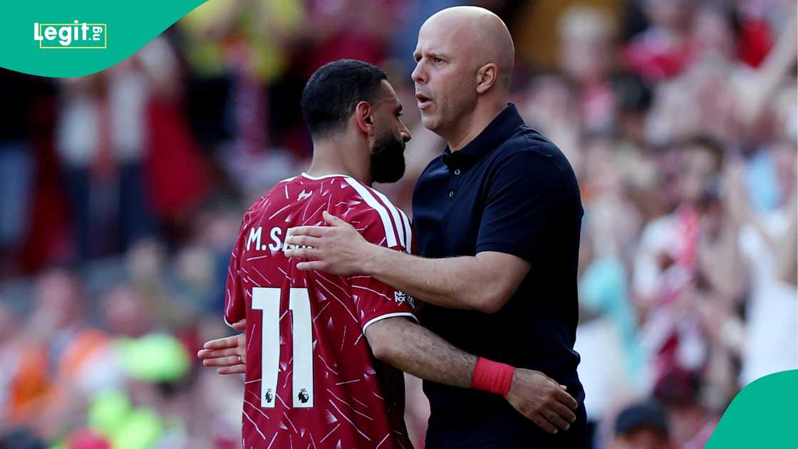 Mohamed Salah embraces Arne Slot after being substituted off against Brentford at Anfield. Photo by Naomi Baker