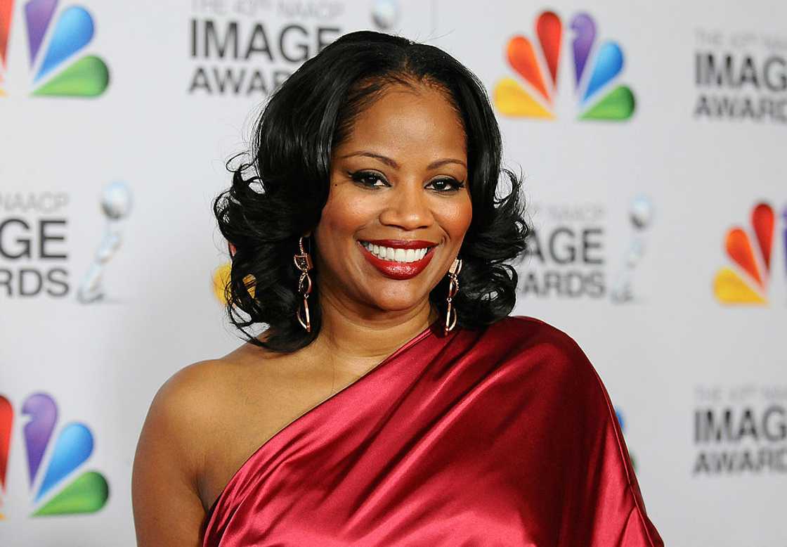 DeShawn Snow in a wine red dress at the 43rd annual NAACP Image Awards at The Shrine Auditorium