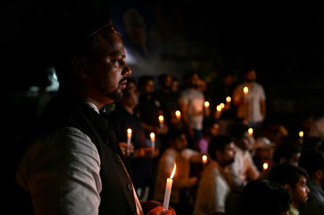 Members of India's Youth Congress take part in a candlelight vigil in New Delhi on Monday for victims of the bridge collapse Members of India's Youth Congress take part in a candlelight vigil in New Delhi on Monday for victims of the bridge collapse