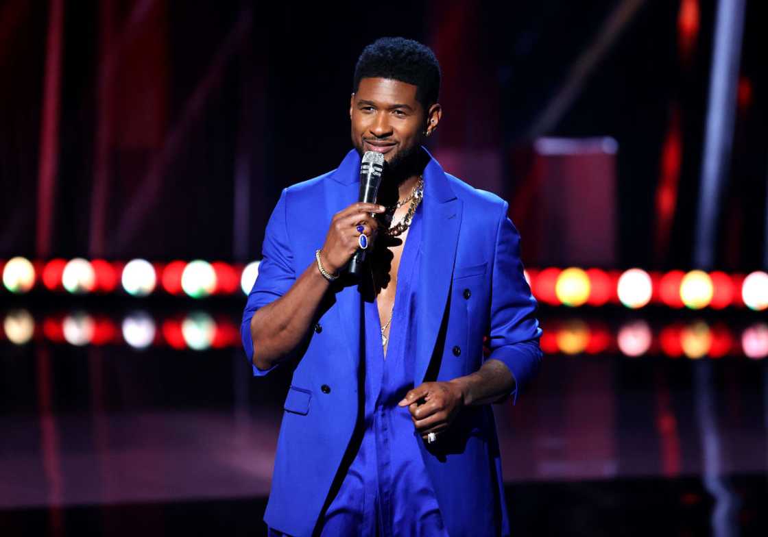 Usher speaks onstage at the 2021 iHeartRadio Music Awards